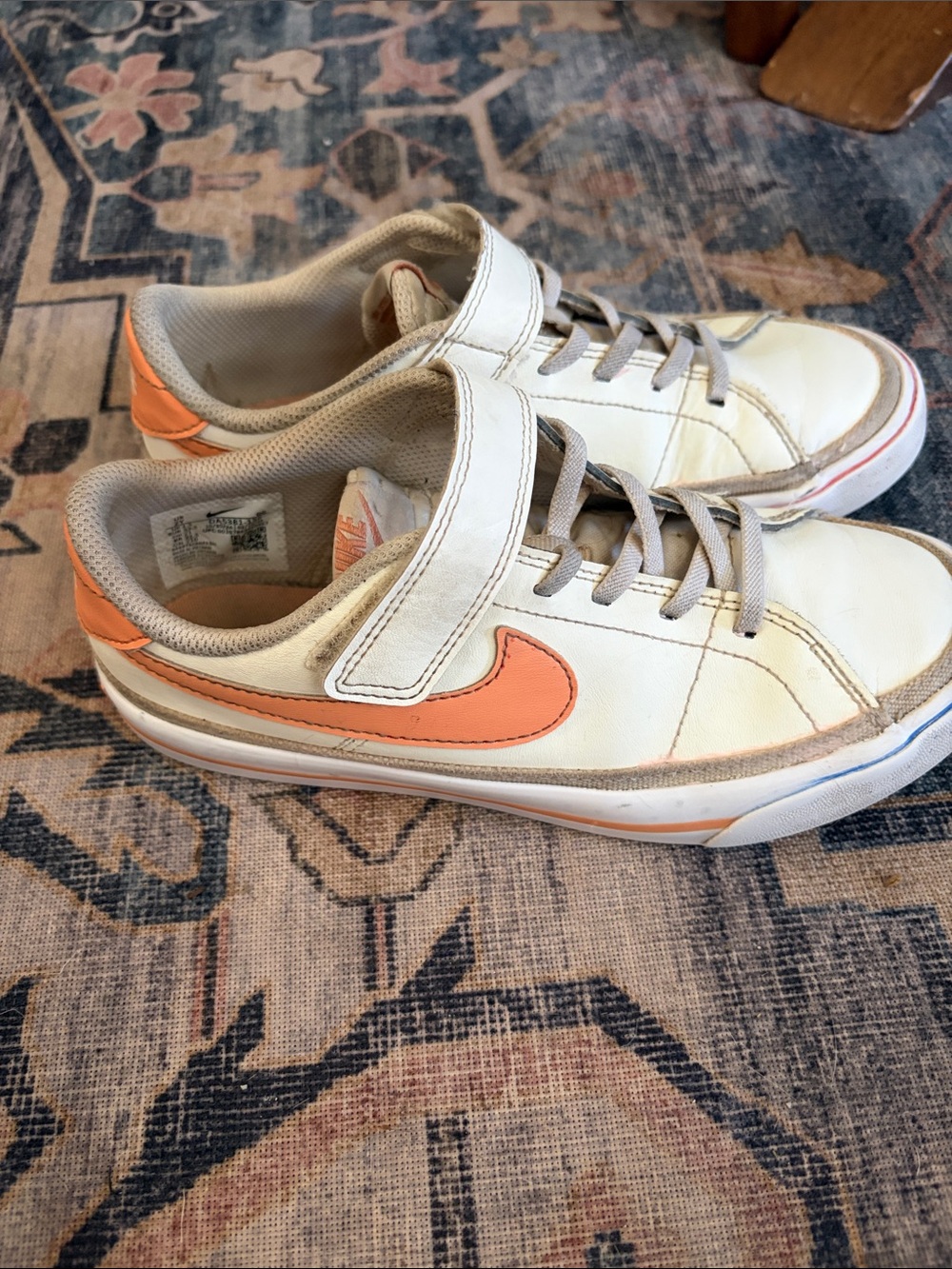 Nike White Sneakers with Peach Swoosh and Heel Accent
